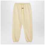 Fear of God Essentials Yellow jogging pants with logo