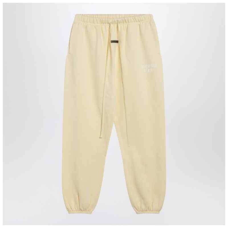 Fear of God Essentials Yellow jogging pants with logo Fear of God Essentials Yellow jogging pants with logo, theFeinheit