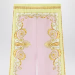 Versace Printed silk twill trousers in yellow/pink