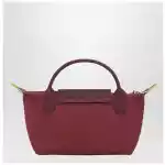 Longchamp Le Pliage Green Pomegranate coloured clutch bag