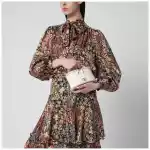 Valentino Garavani Vlogo Signature Mini Vanity Bag in ivory grained calfskin