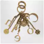 Chloé Bag charm keyring Symbols Logo in vintage gold brass
