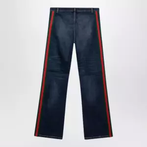 GUCCI Low-rise cotton denim Web tape trousers in blue