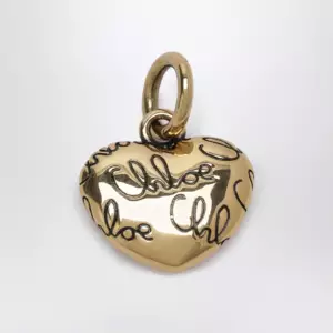 Chloé Alphabet heart logo charm in brass, gold